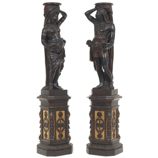 Appraisal: TWO IMPRESSIVE CARVED EBONIZED AND GILT WOOD BLACKAMOOR NUBIAN SCULPTURES