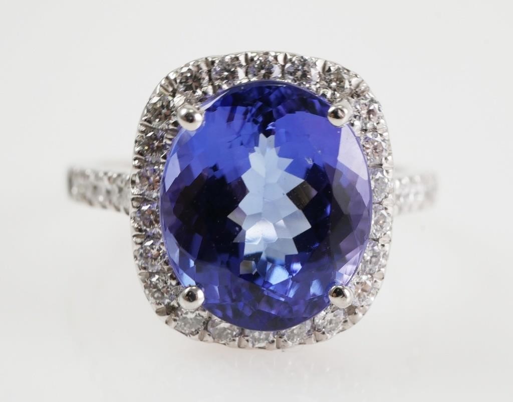 Appraisal: PLATINUM TANZANITE DIAMOND RINGProng set in platinum oval tanzanite approx