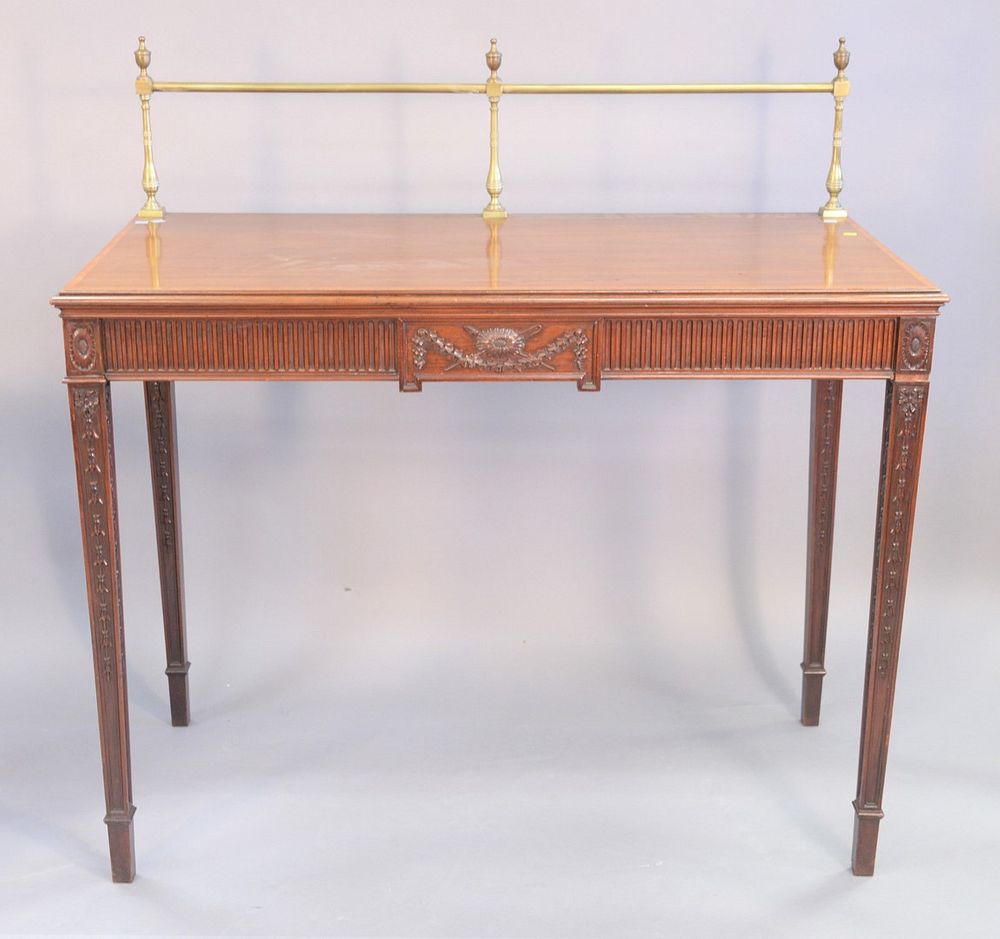 Appraisal: Mahogany inlaid server having brass gallery back and carved tapered