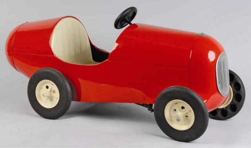 Appraisal: Pressed Steel Racing Pedal Car Toy Description Very unusual design