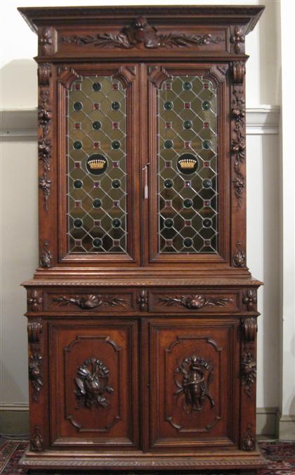 Appraisal: Carved oak library bookcase on cabinetlate th early th century