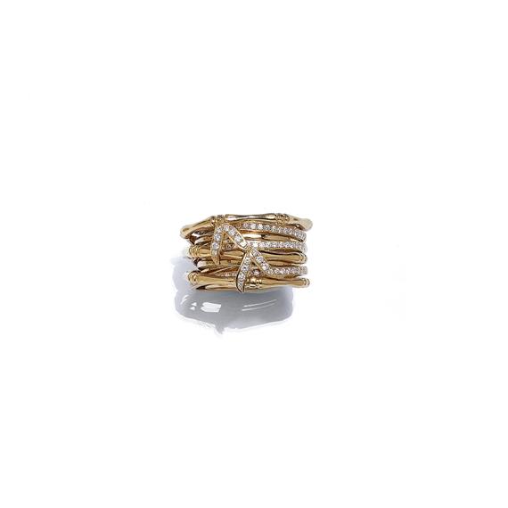 Appraisal: A GOLD AND DIAMOND RING Pink gold Decorative band ring