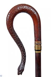 Appraisal: Gun Snake Cane Ca A foreign carved snake handle with