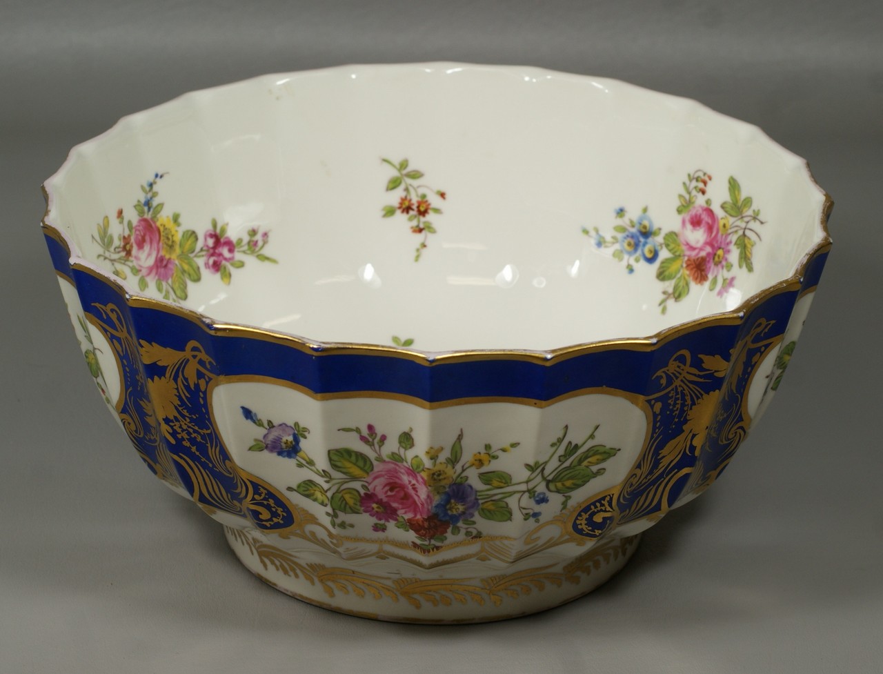 Appraisal: Swansea porcelain scalloped center bowl gilt decorated blue border HP