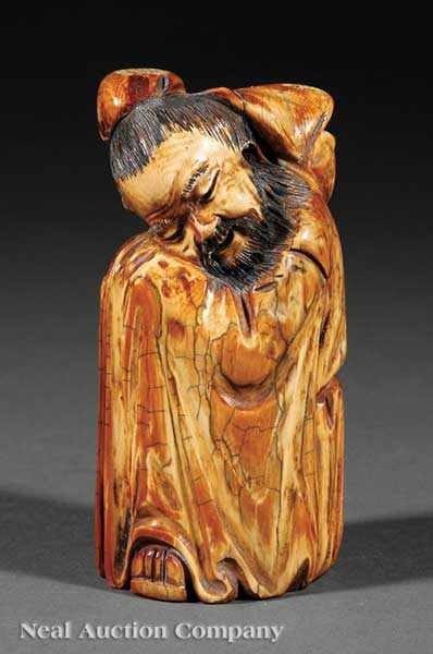 Appraisal: A Chinese Stained Ivory Figure of a Sleeping Lohan robed