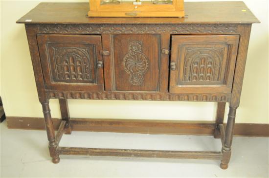 Appraisal: Continental style oak cabinet with carved front panels two hinged