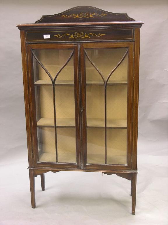 Appraisal: An Edwardian mahogany display cabinet raised back and frieze with