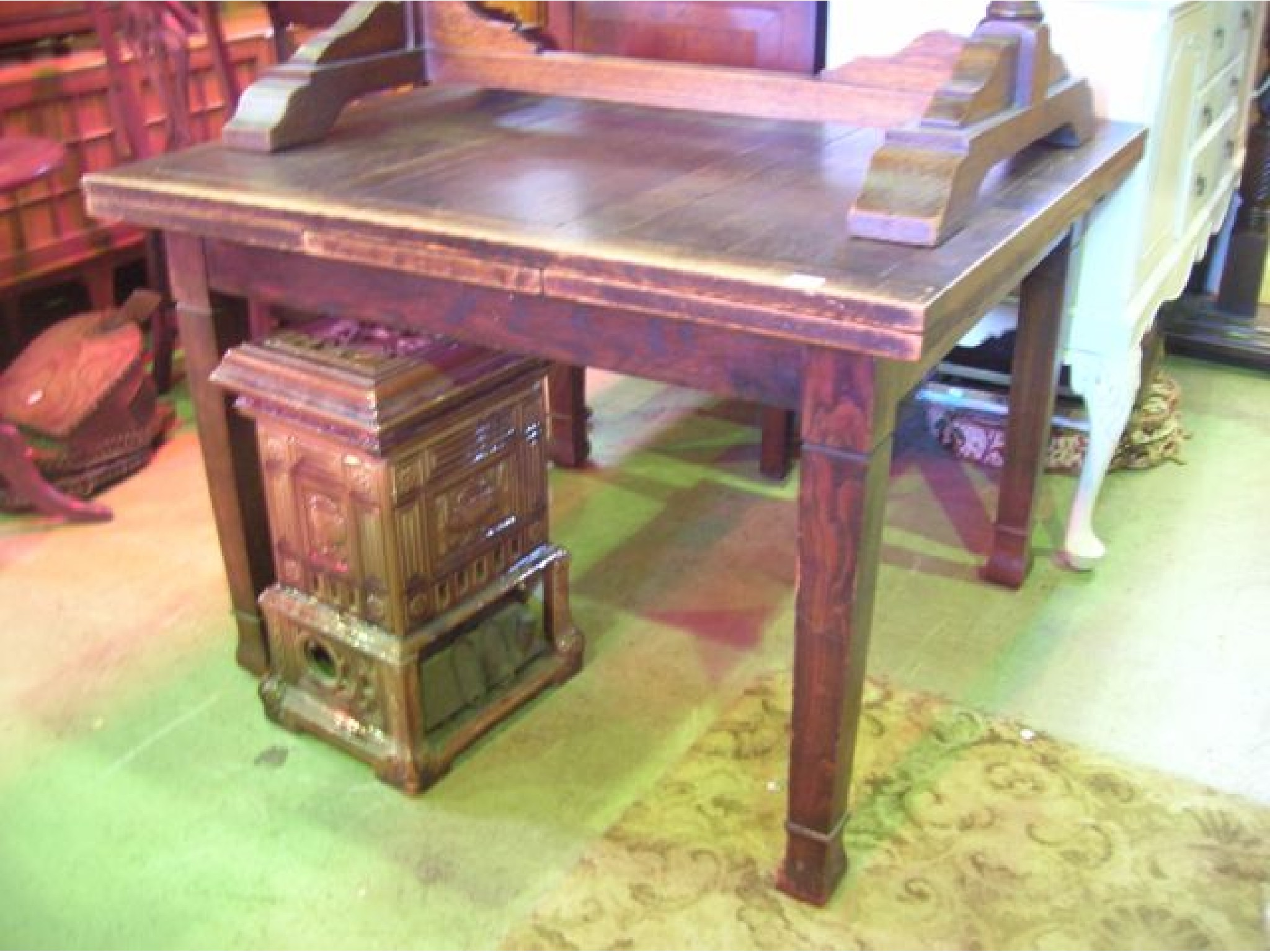 Appraisal: An outsized oak plank top draw leaf dining table raised