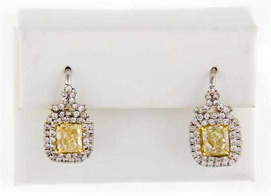 Appraisal: Pair fancy yellow diamond and platinum earrings centered by rectangular