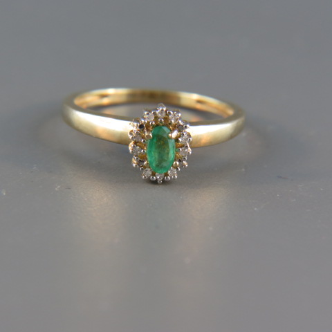 Appraisal: Emerald and Diamond Ring oval gem surrounded by diamonds in