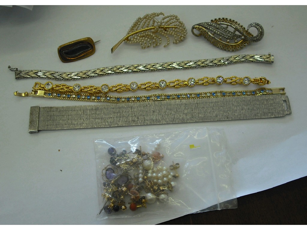 Appraisal: Two silver bracelets various pairs and single earrings two gold