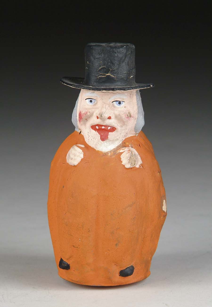 Appraisal: PUMPKIN BODY FIGURAL CANDY CONTAINER Molded paper mache pumpkin body