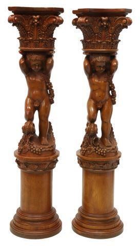 Appraisal: pair Neoclassical style carved mahogany pedestals stands figural putto surmounted