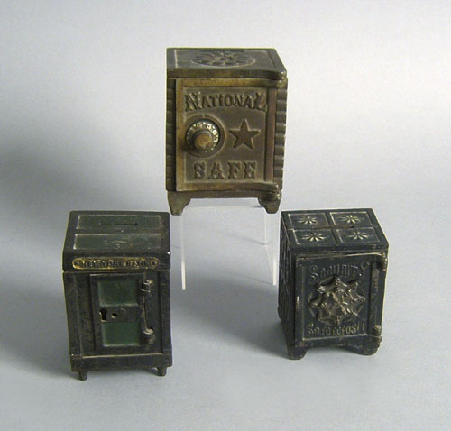 Appraisal: Three cast iron safe banks two - h one -