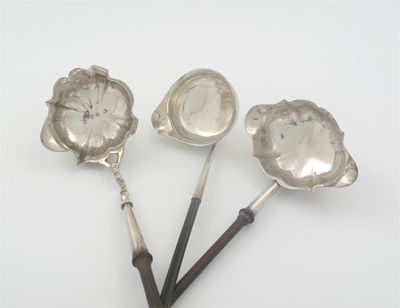 Appraisal: Three punch ladles a George III double-lipped example with a