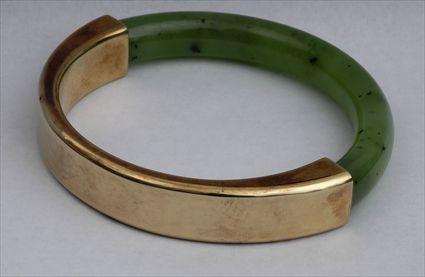 Appraisal: JADE AND K GOLD BANGLE in diam Provenance Property from