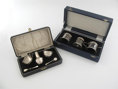 Appraisal: Two cased modern three piece condiment sets one with engine-turned