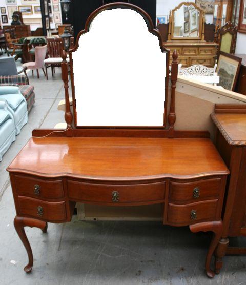 Appraisal: A stained maple dressing table cms long x cms wide