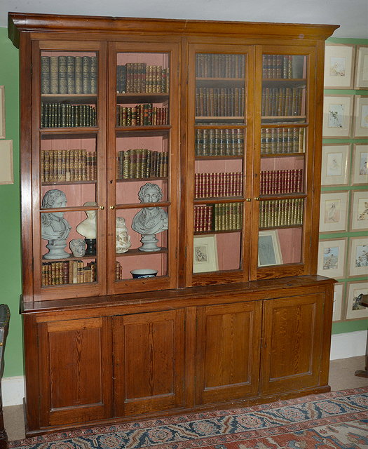 Appraisal: A VICTORIAN PITCH PINE LIBRARY BOOKCASE the four glazed doors