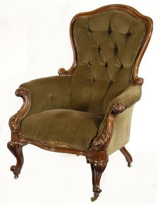 Appraisal: A Victorian carved walnut easy armchair with button upholstered back