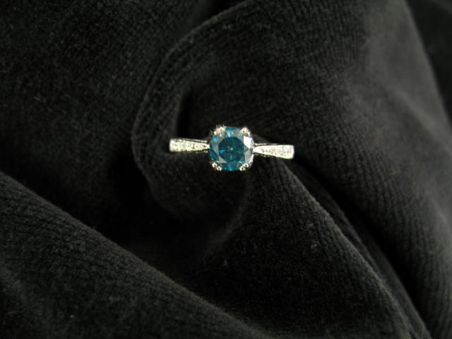 Appraisal: Blue Diamond Ring carat round diamond with diamonds on each