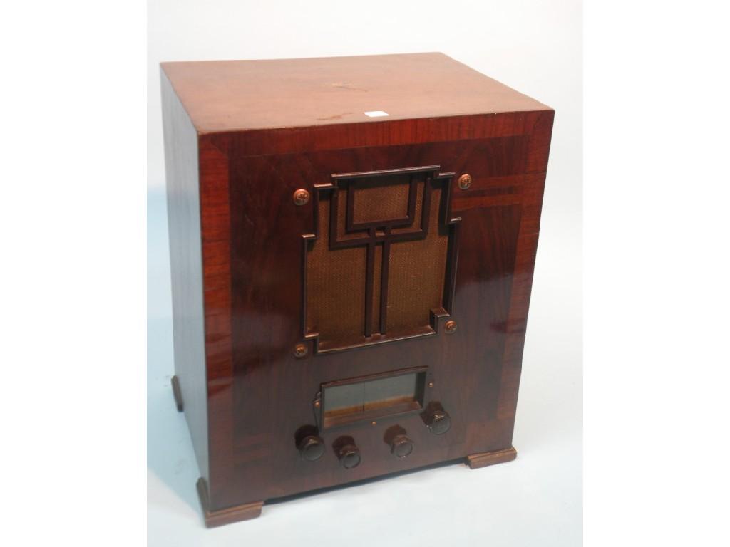 Appraisal: A Marconi radio in a walnut and crossbanded case with