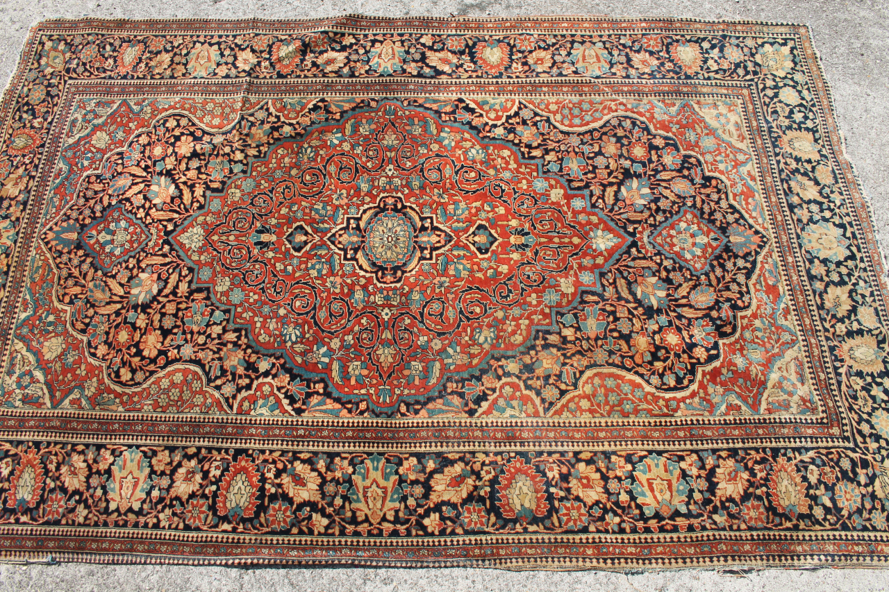 Appraisal: A Middle Eastern hearth rug with rectangular outline with a