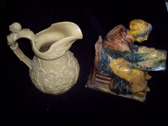 Appraisal: A pottery figure of a lacemaker modelled seated cm high