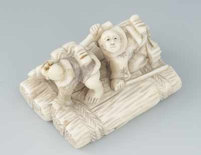 Appraisal: A Carved Ivory Netsuke of Two Men on Water Raft