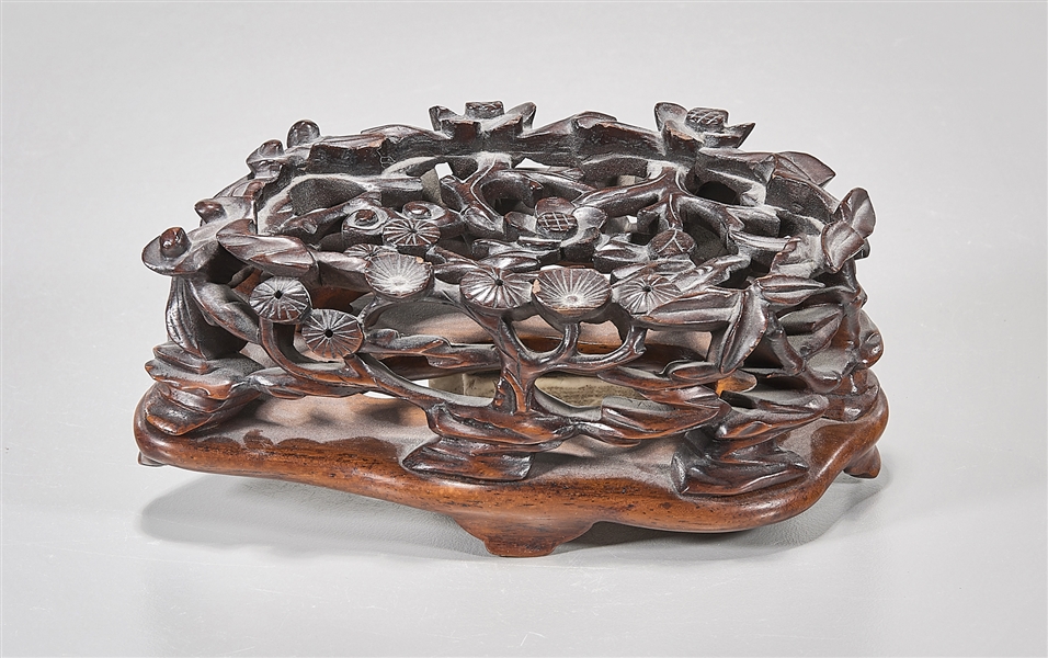 Appraisal: Chinese elaborately carved hard wood two section stand x x