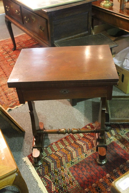 Appraisal: A VICTORIAN MAHOGANY FOLD-OVER WORK TABLE with rectangular top