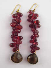 Appraisal: A pair of garnet and smokey quartz earrings drop approx