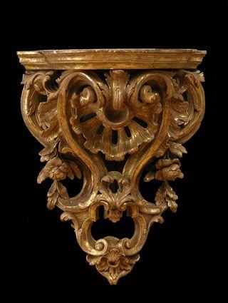 Appraisal: GEORGE III-STYLE CARVED GILTWOOD WALL BRACKET The serpentine shelf above