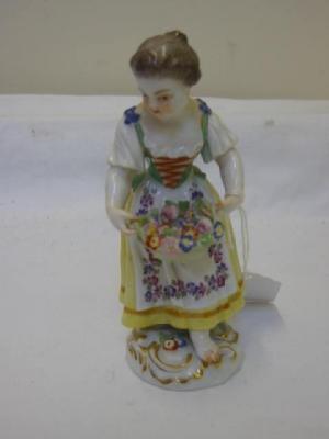 Appraisal: A MEISSEN PORCELAIN FIGURE of a girl wearing a cream