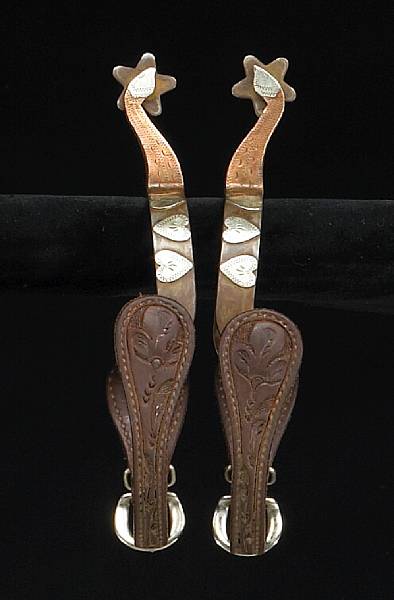 Appraisal: A pair of copper and silver-mounted goose neck spurs Single