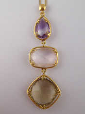 Appraisal: An carat gold amethyst rose quartz and citrine pendant necklace