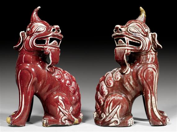 Appraisal: A PAIR OF SANG DE BOEUF GLAZED MYTHICAL BEASTS China