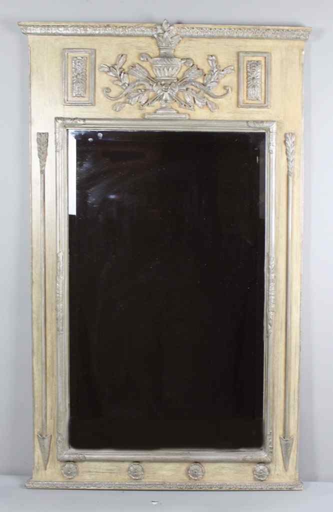 Appraisal: CONTINENTAL STYLE PAINTED AND SILVERED MIRROR the molded leaf-tip carved