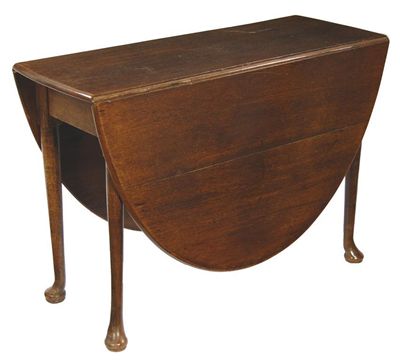 Appraisal: A mid th century oak drop leaf table the oval