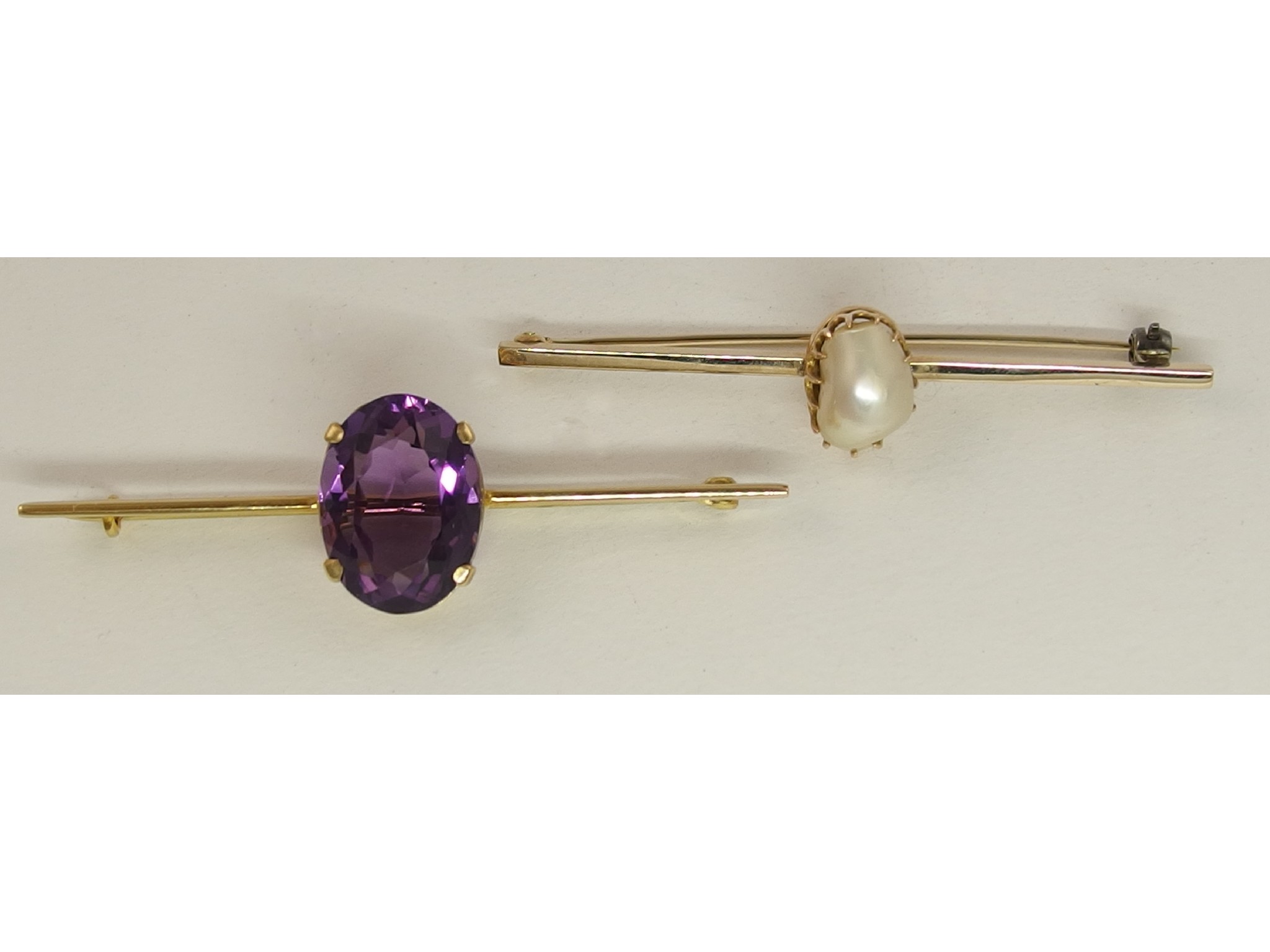 Appraisal: A ct amethyst bar brooch together with a pearl set