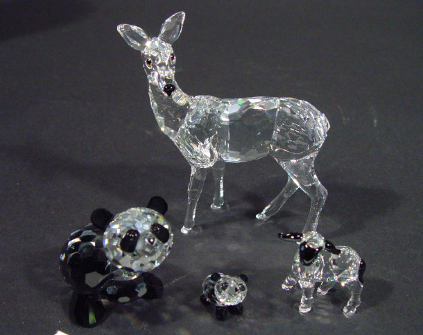 Appraisal: Four Swarovski crystal animals with black flashed detailing a deer