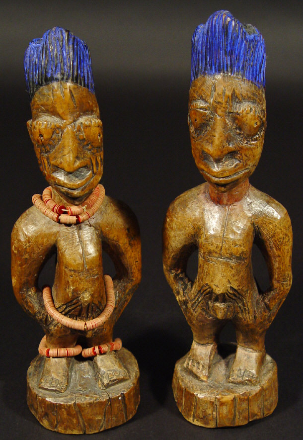 Appraisal: Two Nigerian Yoruba tribal wooden figures with blue painted hair