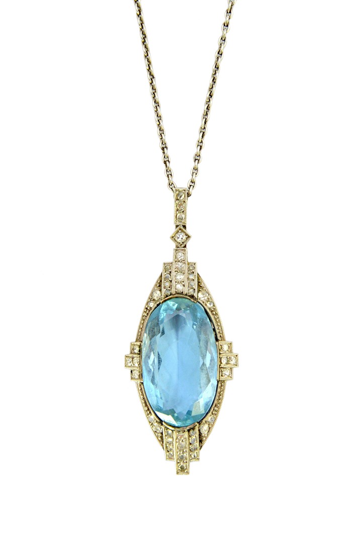 Appraisal: An aquamarine and diamond set pendant mounted with the oval