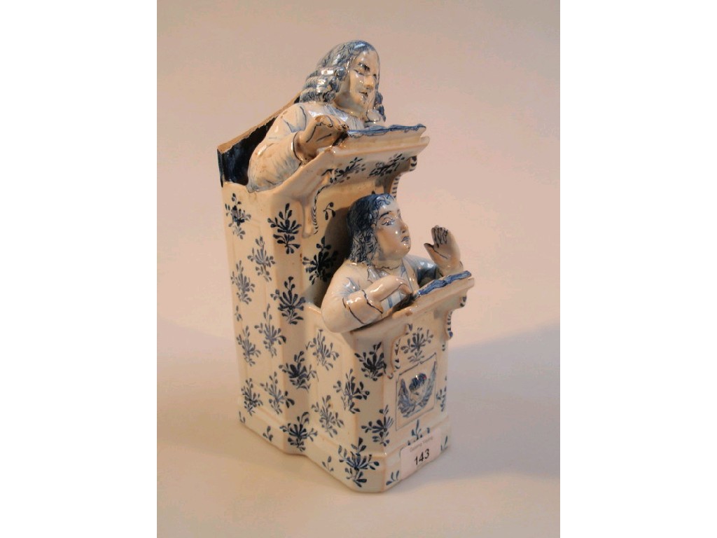 Appraisal: A Delft Vicar and Moses group painted in underglaze blue