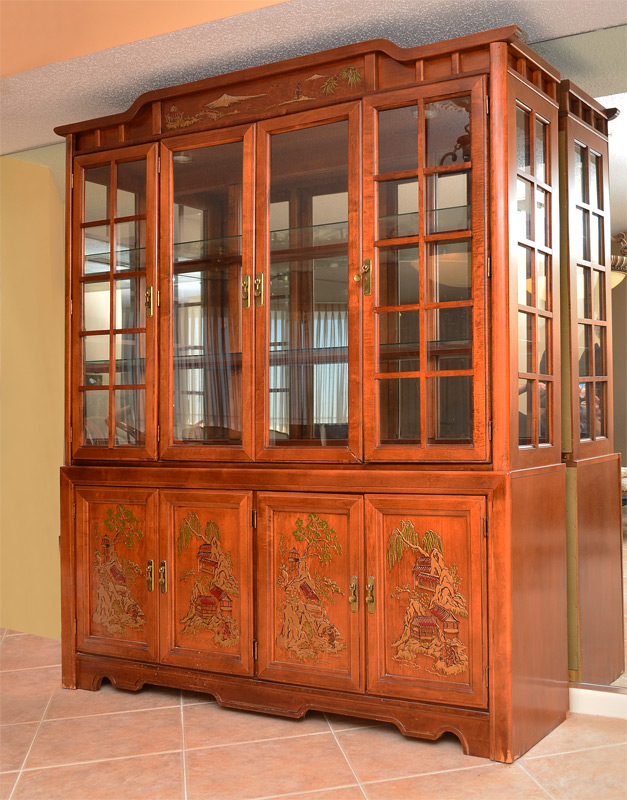 Appraisal: CHINOISERIE DECORATED BREAKFRONT CHINA CABINET Shape top crest with applied