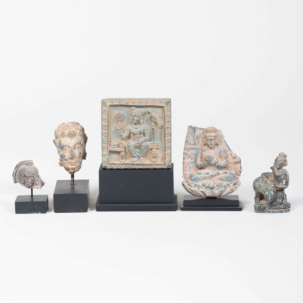 Appraisal: Group of Miniature Indian Schist Figures Each mounted on a