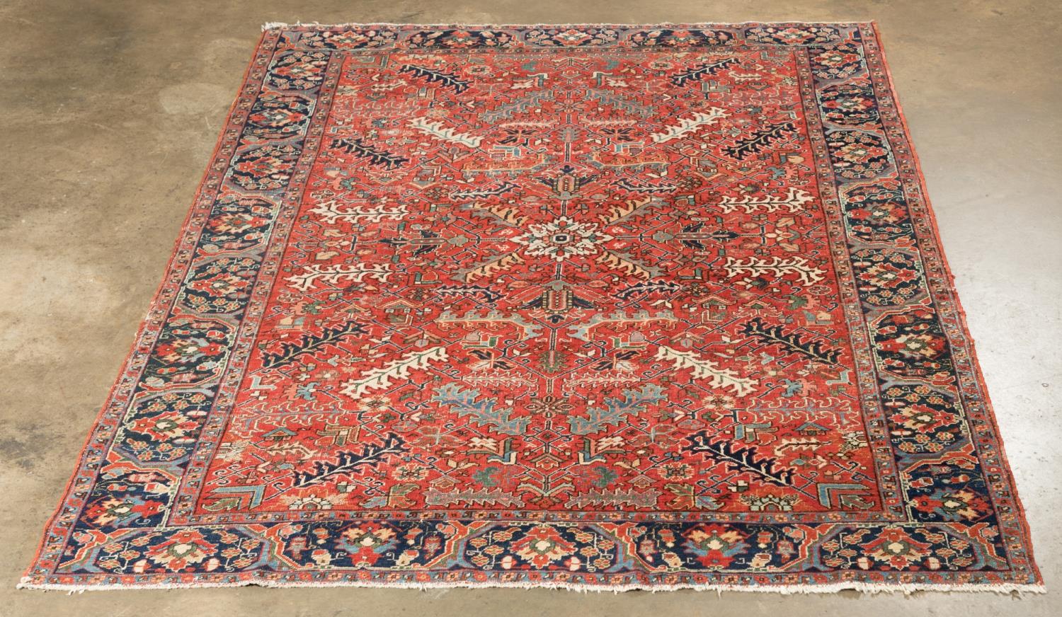 Appraisal: HAND KNOTTED WOOL PERSIAN HERIZ RUG X Hand knotted wool