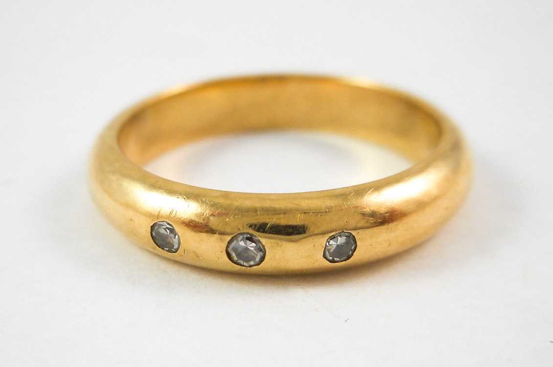 Appraisal: DIAMOND AND FOURTEEN KARAT GOLD RING bezel set with three