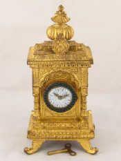 Appraisal: A gilt mantel clock in the Indian Arabic manner the