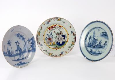 Appraisal: Three English delftware dishes th Century comprising a blue and